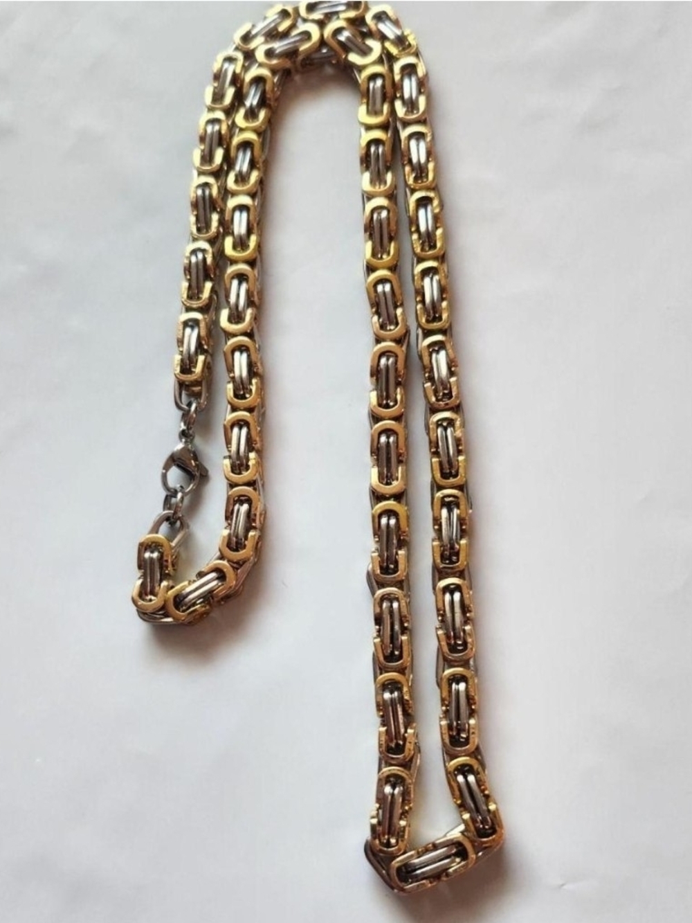 Gold and Silver Two-tone Chain features a complex Byzantine link design